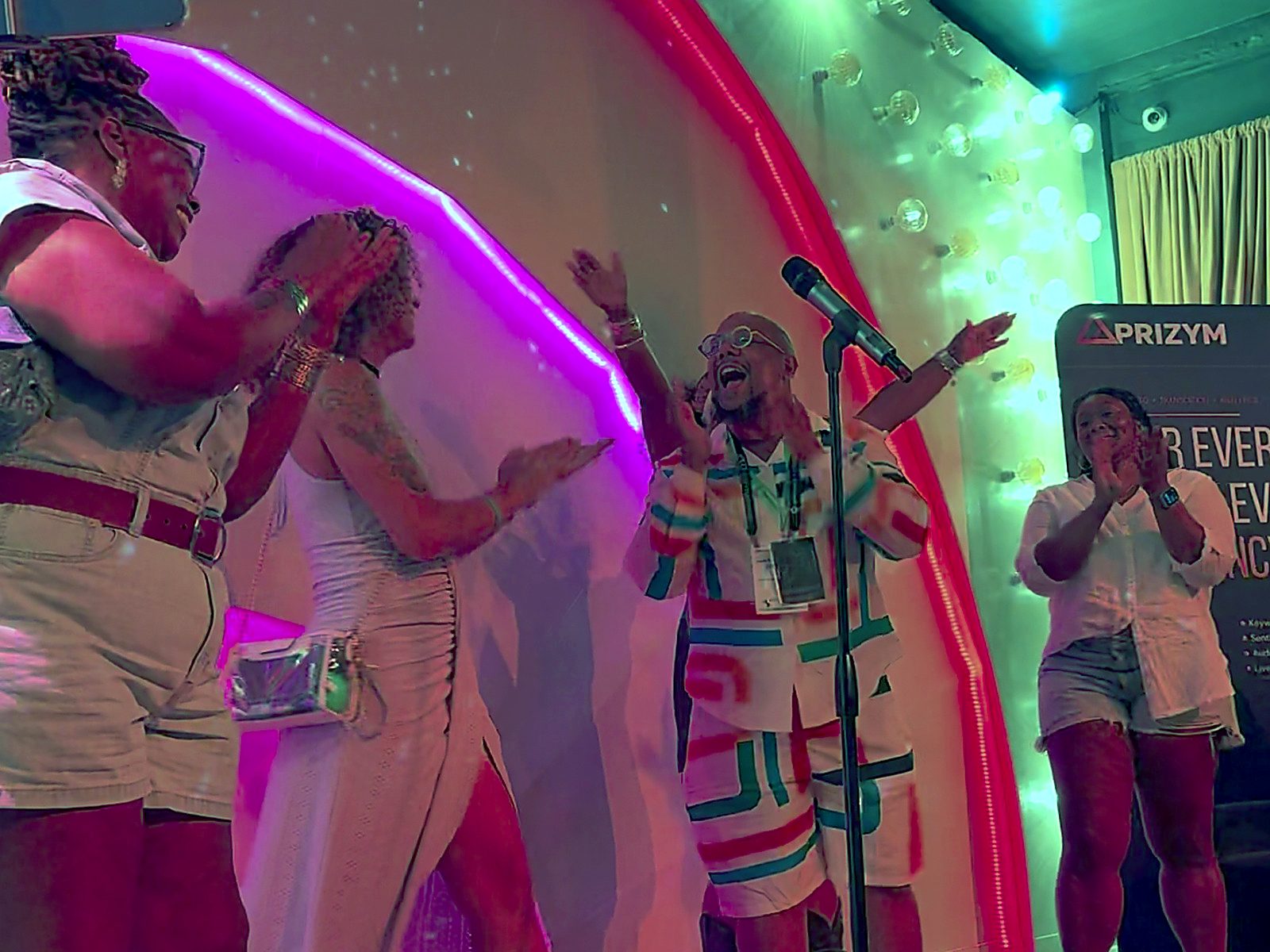 Karaoke performers on stage at Mic Drop APCO 2026